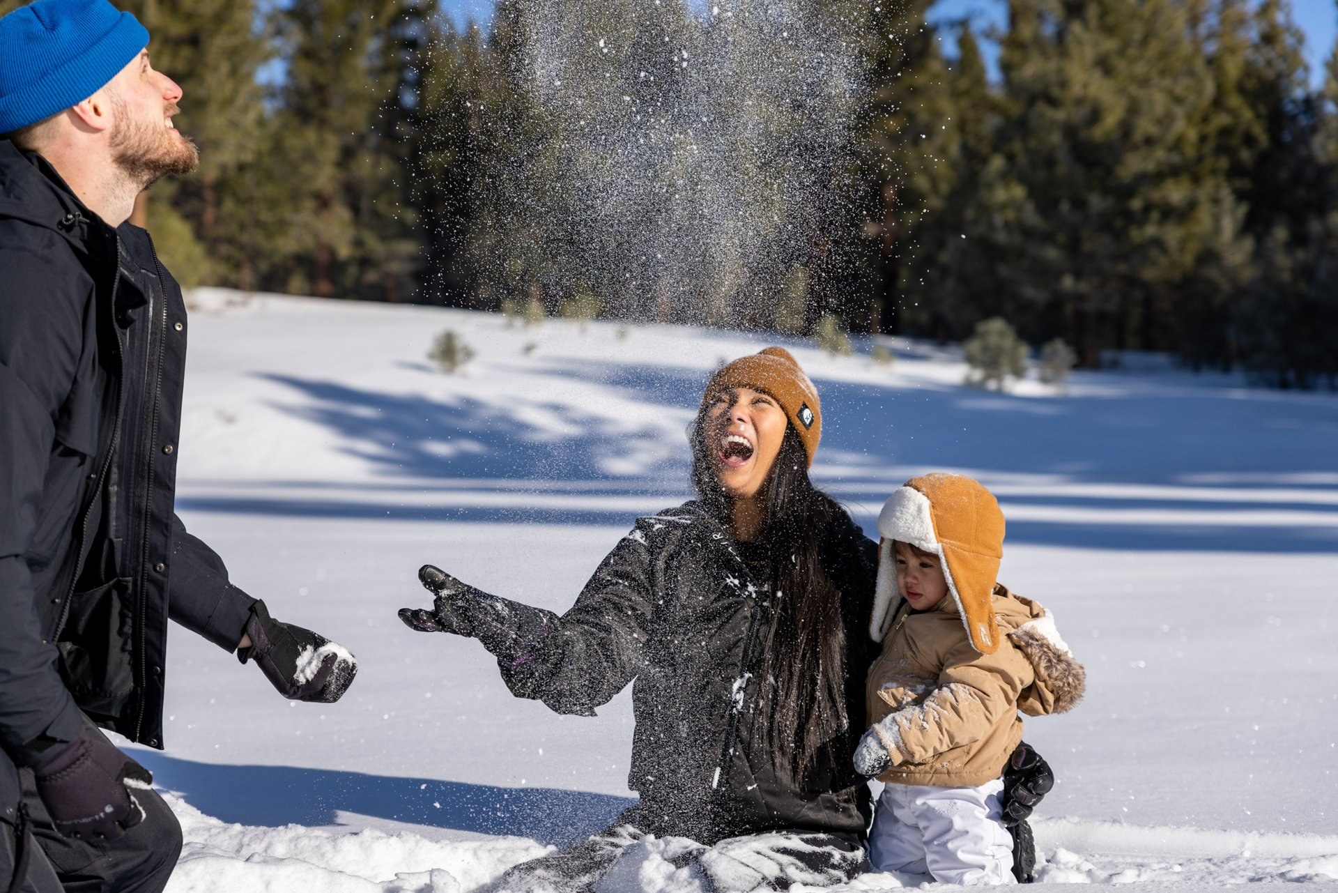 Family playing in snow